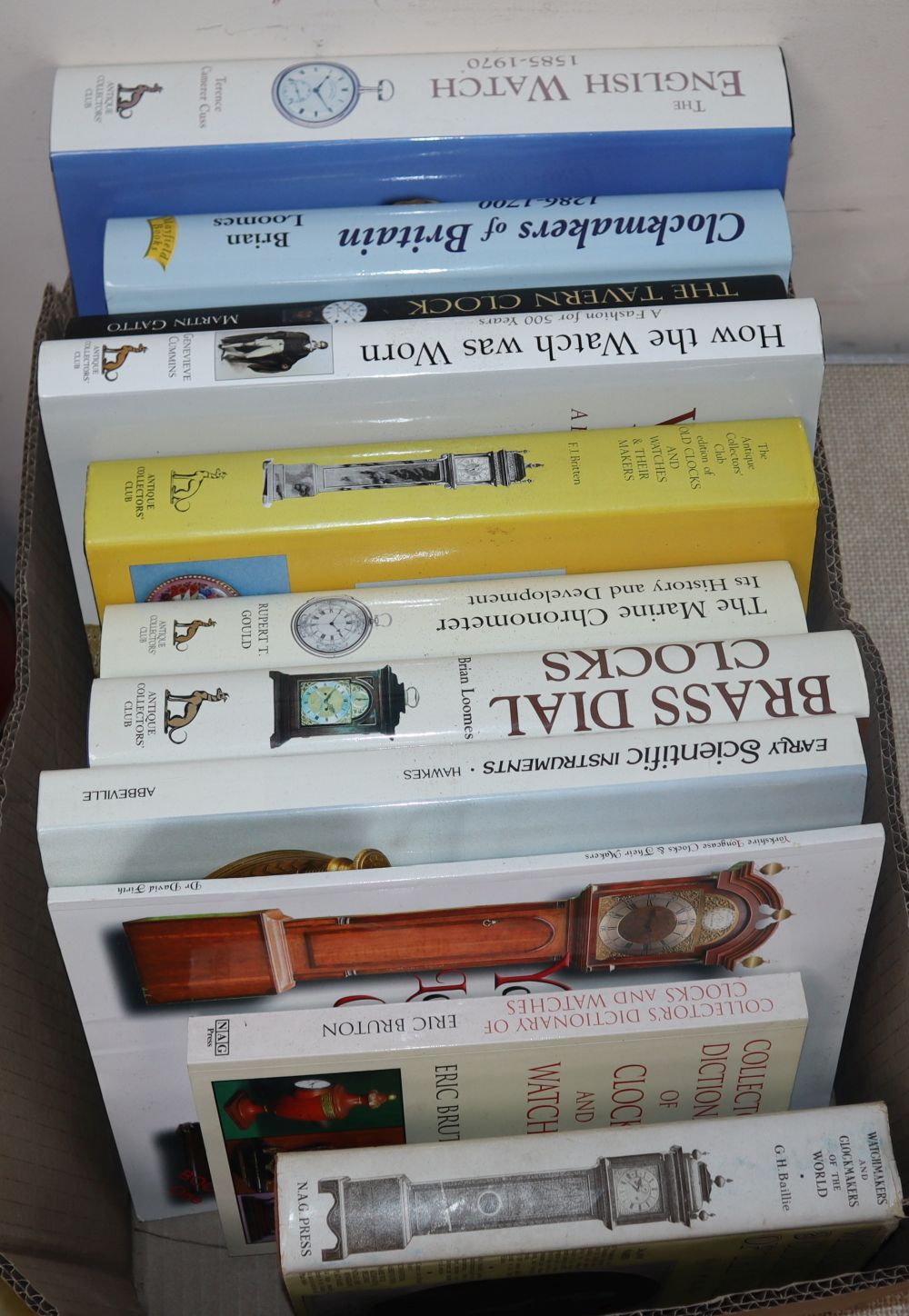 A collection of clock reference books including:
